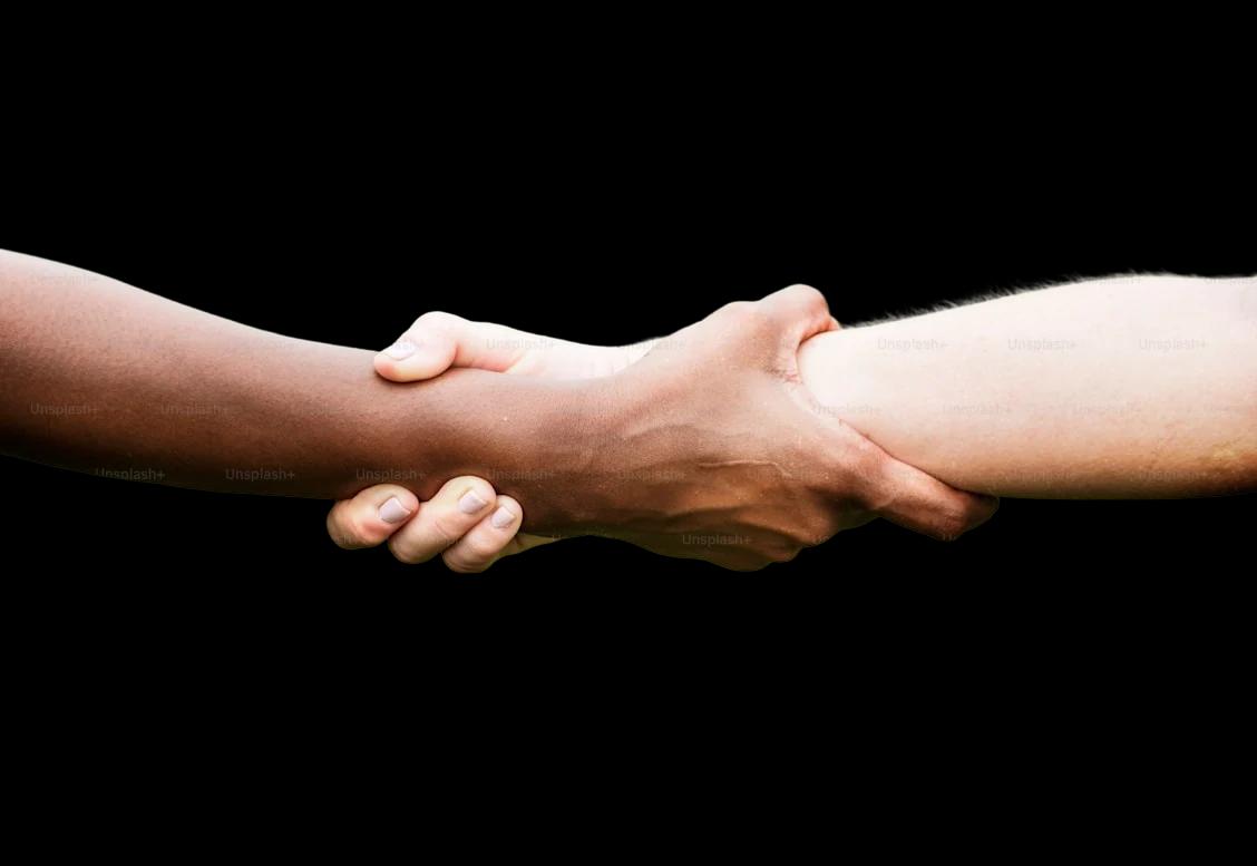 Two people holding hands across different backgrounds
